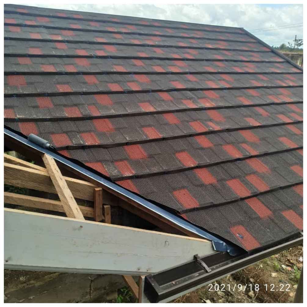 Eurotiles Roofing Sheets cut along the valley gutter | Pictured in Ghana