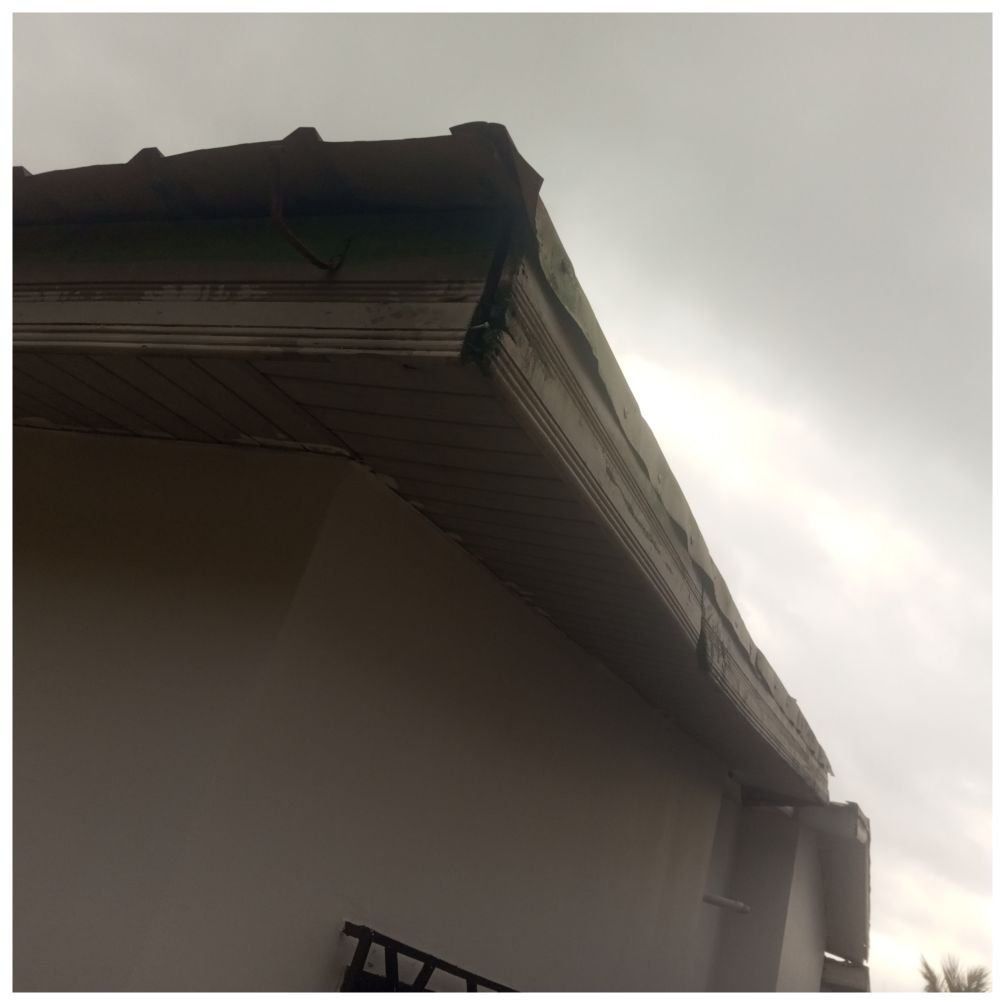 Old decaying wooden fascia boards before they were replaced