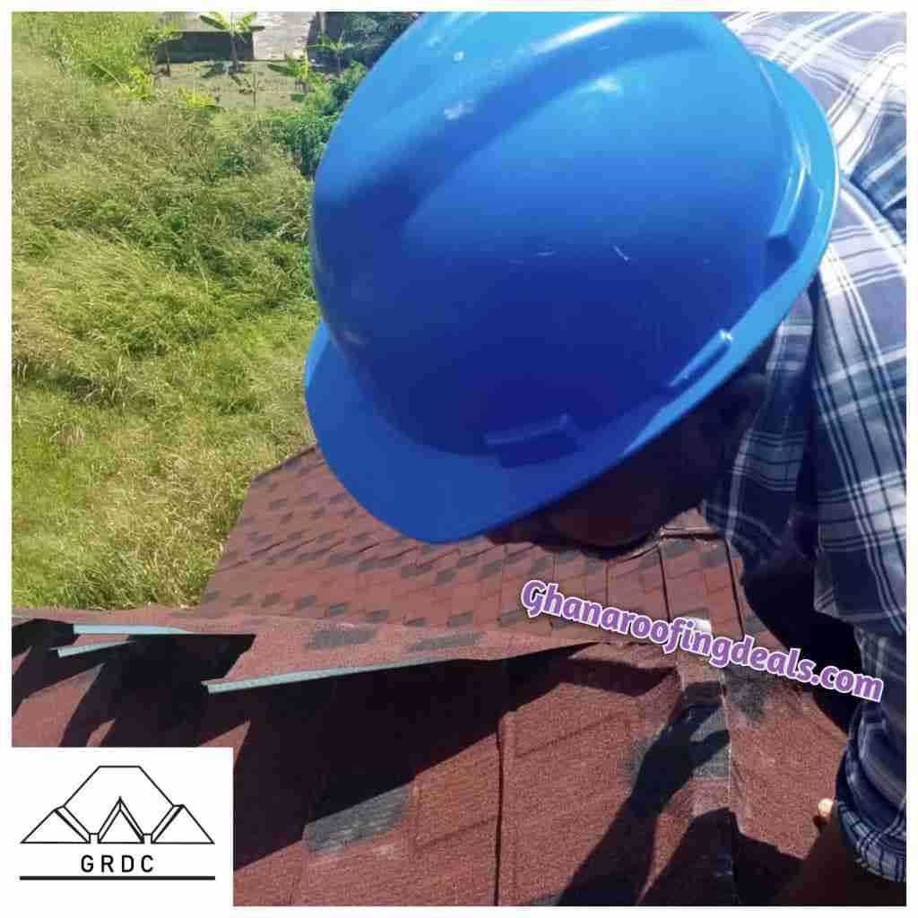 Installer of Eurotiles Stone Coated Roofing Sheets Working on a roof | Ghana Roofing Deals